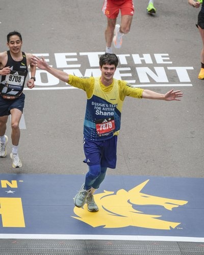 Shane Johnson crosses the finish line Boston 2026
