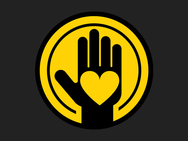 ellow circle logo with raised black hand and heart in palm, symbolizing giving and kindness.